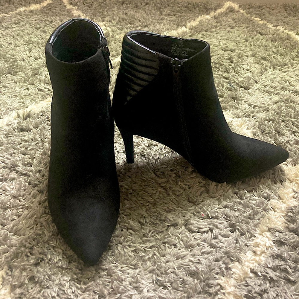 Black boots with heel.